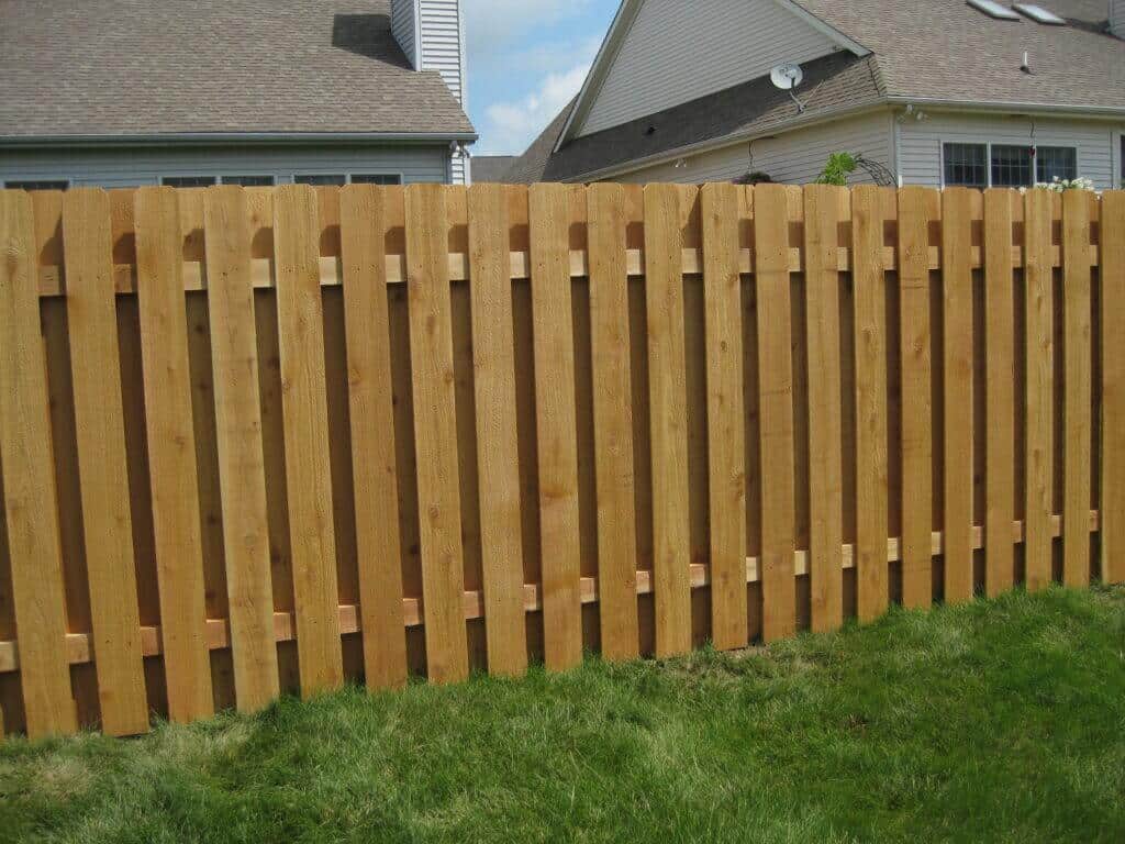 Work with Bullseye Fence Design for Hamilton County Fence Installation image shows wooden fence on grass