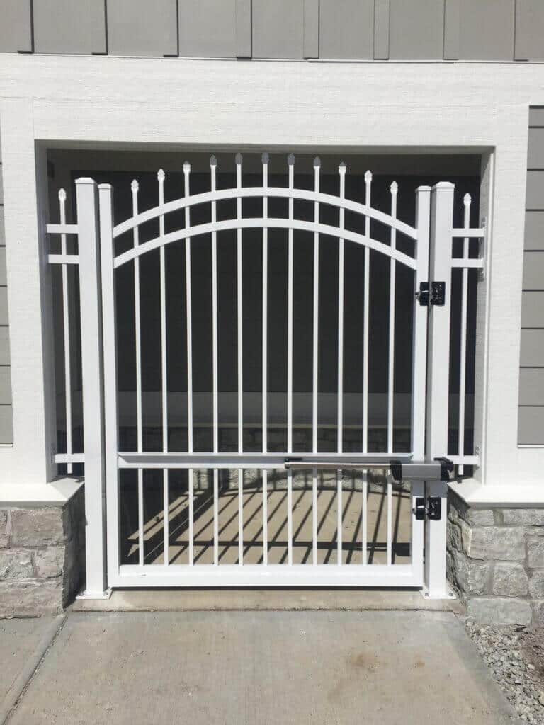 Reach out to Bullseye Fence Design for Carmel Wrought Iron Fence options image shows gray fence gate
